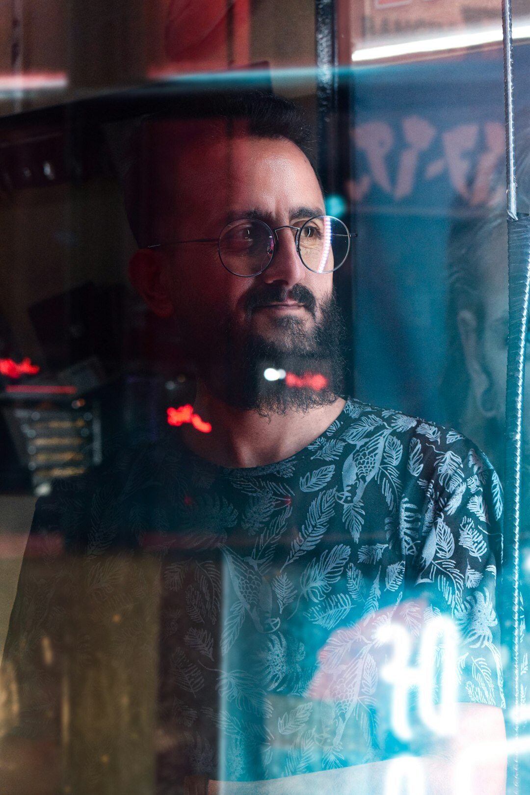 Portrait of a man moderator with glasses and short beard