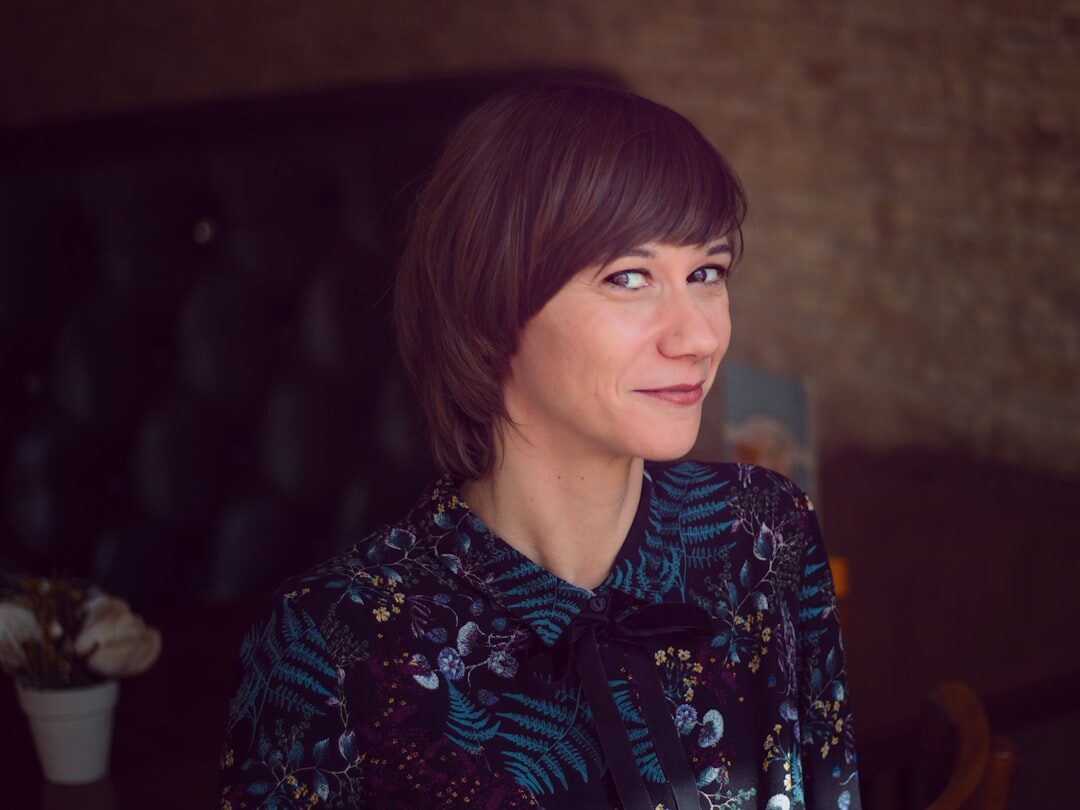 Portrait of a woman moderator with short brown hair