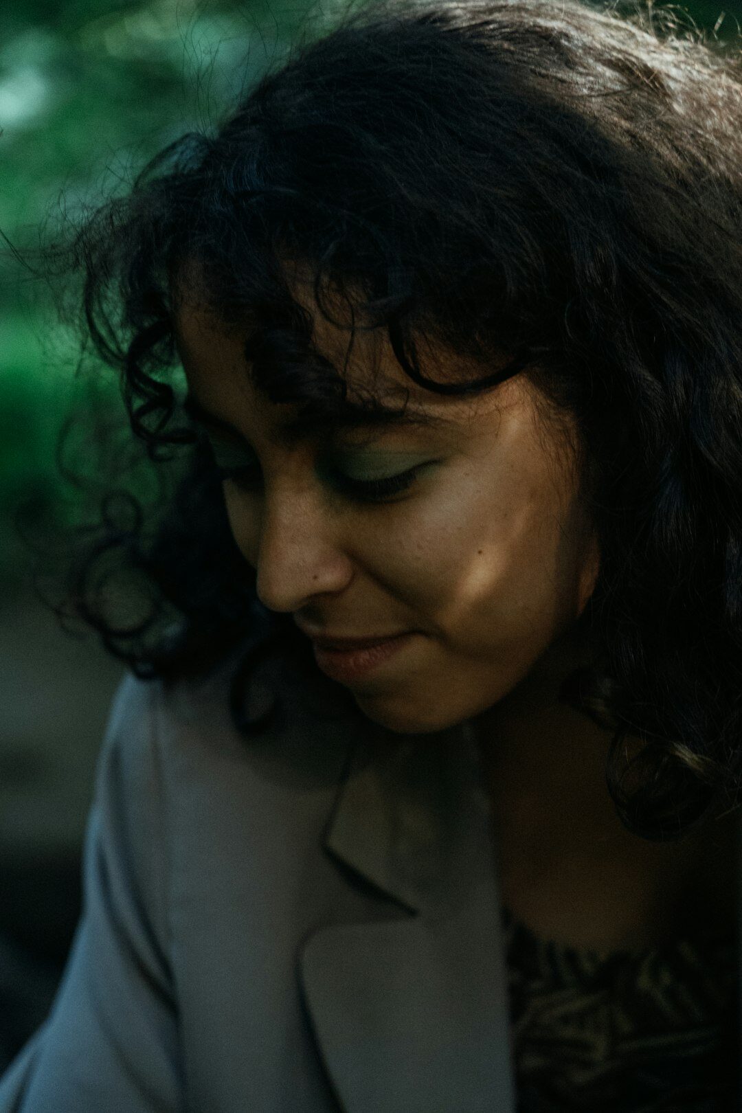 Portrait of a woman expert with curly dark hair