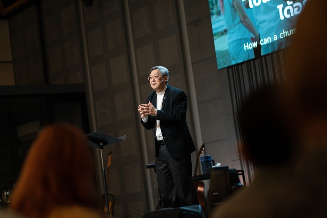 Speaker presenting to an audience at a conference