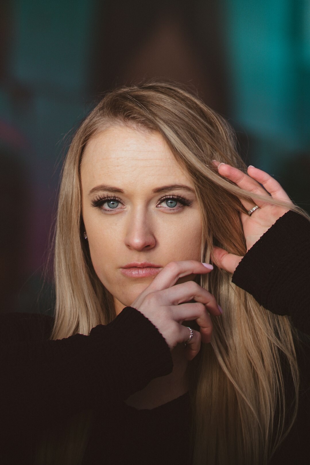 Portrait of a young woman moderator with long blonde hair